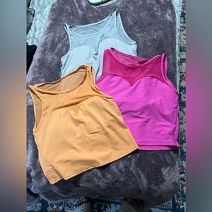 Kortni Jeane Bikinis in Gray, Orange, and Pink